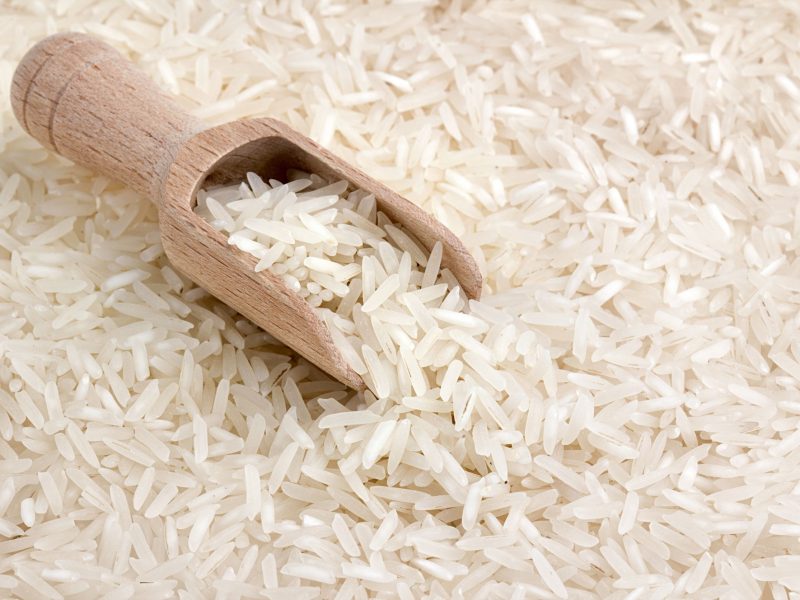 19601061 - close up of basmati rice with wooden scoop