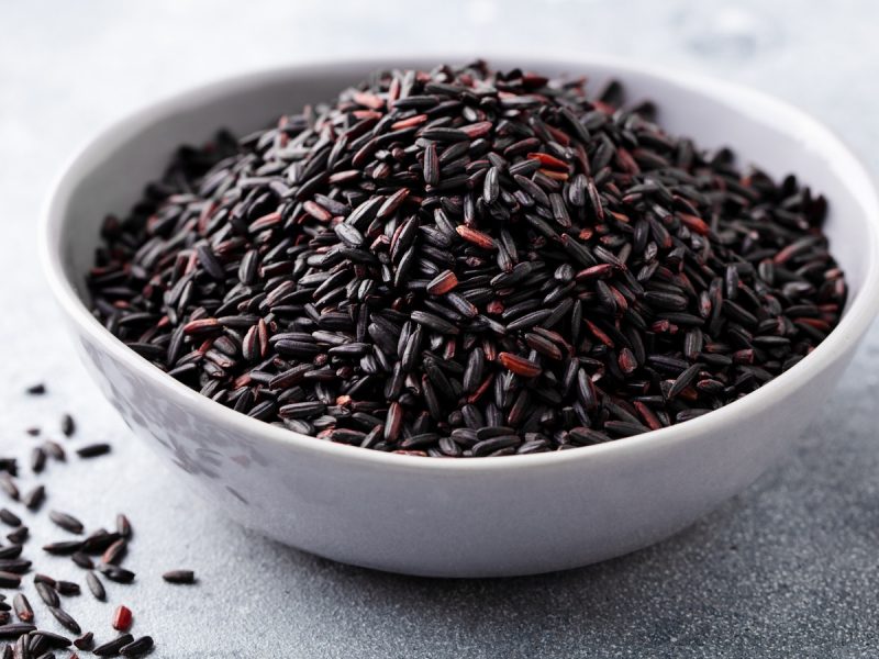 Black,Wild,Rice,In,A,Bowl.,Grey,Stone,Background.,Close